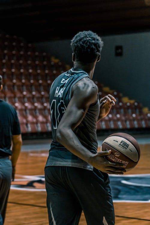 Free Man Holding Fiba Basketball Stock Photo